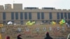 FILE - Portraits of fighters from Kataeb Hezbollah are seen on the wall of the U.S. Embassy in the Iraqi capital, Baghdad, Jan. 1, 2020. Facilities used by Kataeb Hezbollah and Kataeb Sayyid al-Shuhada were destroyed by U.S. airstrikes on Feb. 25, 2021.