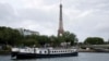 FILE - Boats rehearse on the River Seine in Paris on June 17, 2024, for the Olympics opening ceremony's floating parade on July 26.