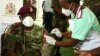 FILE - Malawi Army Commander Vincent Nundwe, seen here receiving a COVID-19 vaccine in Zomba, Malawi, March 11, 2021, has called for less government interference in military affairs. 