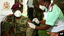 FILE - Malawi Army Commander Vincent Nundwe, seen here receiving a COVID-19 vaccine in Zomba, Malawi, March 11, 2021, has called for less government interference in military affairs. 