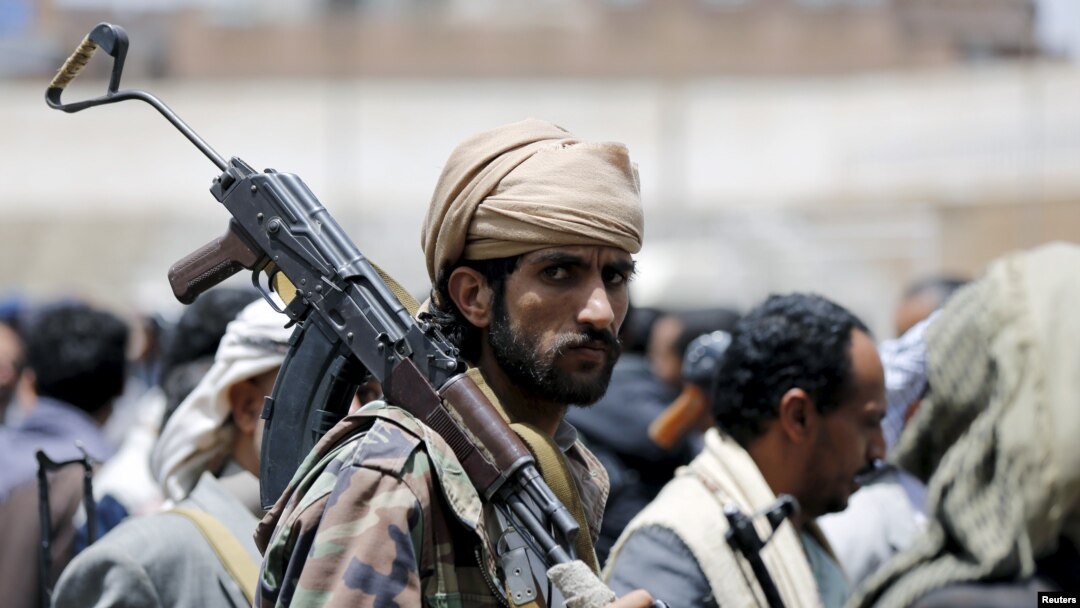A tribesman loyal to the Houthi movement carries his rifle as he attends a gathering in Yemen's capital Sanaa, April 17, 2016.