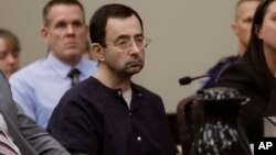 FILE - Larry Nassar sits during his sentencing hearing in Lansing, Michigan, Jan. 24, 2018.