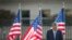 President Barack Obama bows his head during a moment of silence at the Pentagon during a ceremony to mark the 13th anniversary of the 9/11 attacks, Sept. 11, 2014.