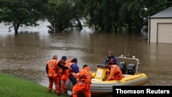 SES personnel carry out an operation during severe flooding in Sydney