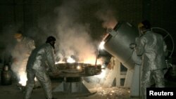 FILE - Technicians work at a uranium processing site in Isfahan, Iran. Pope Francis, in a United Nations speech, called for 'a world free of nuclear weapons.'