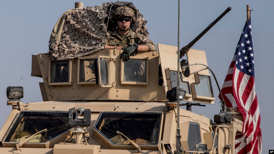 U.S. military convoy drives near the town of Qamishli, northen Syria, Oct. 26. 2019. Two successful raids by U.S.-led coalition in the oil-rich Deir el-Zour area were highlighted with the capture of a mid-level Islamic State leader.