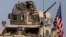 U.S. military convoy drives near the town of Qamishli, northen Syria, Oct. 26. 2019. Two successful raids by U.S.-led coalition in the oil-rich Deir el-Zour area were highlighted with the capture of a mid-level Islamic State leader.