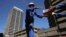 Workers transfer bricks at a construction site in Johannesburg, South Africa. (file photo) 
