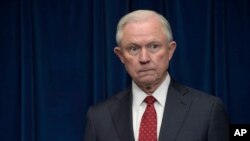 FILE - Attorney General Jeff Sessions waits to make a statement at the U.S. Customs and Border Protection office in Washington, March 6, 2017. With his future as attorney general now in limbo, many Republican lawmakers have come to his support.