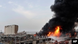 Firefighters work to extinguish a blaze at warehouses at the seaport in Beirut, Lebanon, Sept. 10, 2020.