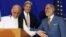 Afghan presidential candidate Abdullah Abdullah, from right, U.S. Secretary of State John Kerry and Afghan presidential candidate Ashraf Ghani Ahmadzai share a light moment at the podium during a joint press conference in Kabul, Afghanistan, Aug. 8, 2014.
