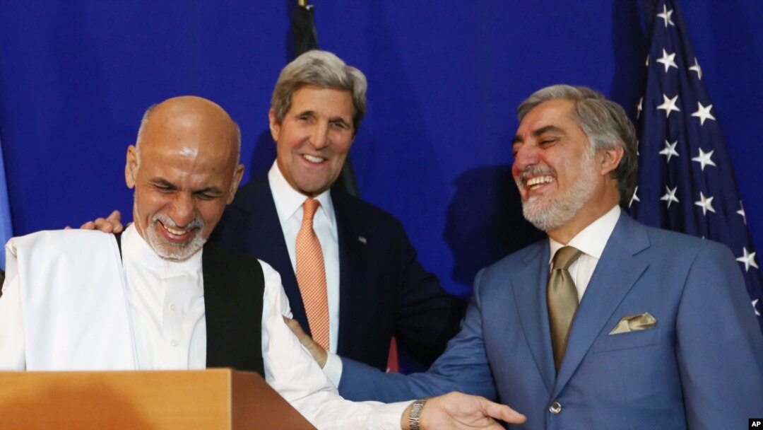 Afghan presidential candidate Abdullah Abdullah, from right, U.S. Secretary of State John Kerry and Afghan presidential candidate Ashraf Ghani Ahmadzai share a light moment at the podium during a joint press conference in Kabul, Afghanistan, Aug. 8, 2014.