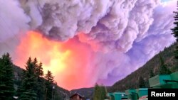 U.S. Forest Service photo shows fire rising over the West Fork Complex in Colorado, June 20, 2013.