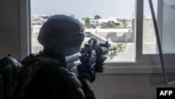This handout picture released by the Israeli army on June 18, 2024 shows Israeli army soldiers operating in the Gaza Strip amid the ongoing conflict in the Palestinian territory between Israel and Hamas.