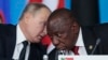 FILE - Russian President Vladimir Putin, left, speaks to South African President, Cyril Ramaphosa, right, during a plenary session at the Russia-Africa summit in the Black Sea resort of Sochi, Russia on Oct. 24, 2019