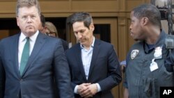 Thomas Frieden, center, leaves Brooklyn federal court, Aug. 24, 2018, in New York. Frieden is the former director of the U.S. Centers for Disease Control and Prevention.