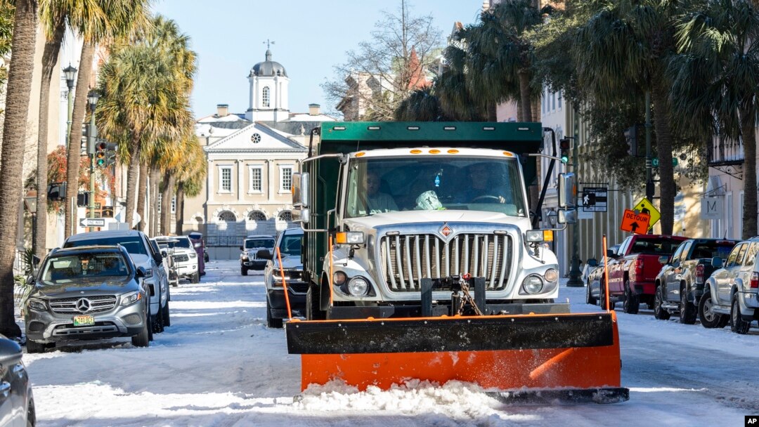 A snowplow clears Broad Street after a winter storm dropped ice and snow on Charleston, South Carolina, Jan. 22, 2025.