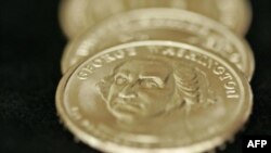 Restrictions: handout
--------------------------------------------------------------------------------
FILE - In this Jan. 24, 2007 file photo provided by the US Mint, new Presidential $1 coins are displayed in Chicago. The presidential dollar coin 