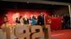 On April 22, 2021, in Beijing, people hold the Chinese national flag while posing for a group picture at an exhibition marking the centennial of the Chinese Communist Party, which falls on Thursday, July 1, 2021. Reuters/Thomas Peter