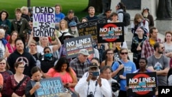 Tribal and environmental groups opposed to the proposed Enbridge Line 3 project rally, Sept. 28, 2017 at the State Capitol in St. Paul, to express concerns about the project's risks to Minnesota's clean water and wildlife.