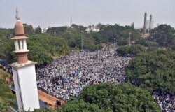 Demonstrators attend a protest rally against a new citizenship law, in Bengaluru, Dec. 23, 2019.