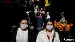  People wear protective face masks due to coronavirus concerns in Istanbul, Turkey March 13, 2020. 