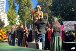 A Native American monument is unveiled in Sacramento, Calif., Tuesday, Nov. 7, 2023. California lawmakers and Native American tribes celebrated the unveiling of a monument outside of the state Capitol building tin the state's historic Capitol Park.