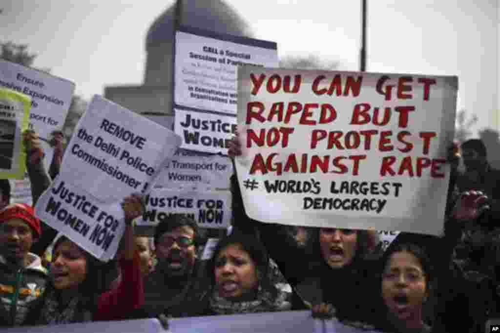 Indian protesters hold placards as they protest against a recent gang-rape of a young woman in a moving bus in New Delhi, India, Thursday, Dec. 27, 2012. Indian Prime Minister Manmohan Singh pledged Thursday to take action to protect the nation's women wh