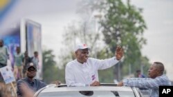 Congolese opposition presidential candidate Martin Fayulu greets well-wishers as he arrives for a rally in Goma, Democratic Republic of the Congo, Nov. 30, 2023.