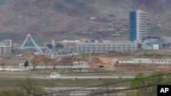 FILE - The Kaesong industrial complex in North Korea is seen from the Taesungdong freedom village inside the demilitarized zone during a press tour in Paju, South Korea, April 24, 201,. The rival Koreas have opened their first liaison office near their tense border to facilitate better communication and exchanges.