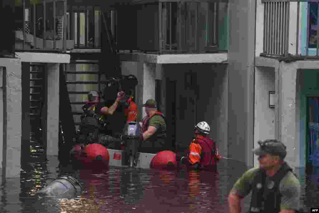 Residents are rescued from an their second story apartment complex in Clearwater that was flooded from and overflowing creek due to Hurricane Milton, Oct. 10, 2024 in Florida.