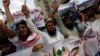 FILE - Supporters of the Jamaat-ud-Dawa organization chant slogans during a protest rally in Karachi, June 27, 2014. 