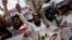 FILE - Supporters of the Jamaat-ud-Dawa organization chant slogans during a protest rally in Karachi, June 27, 2014. 