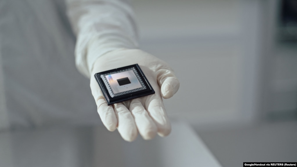 A person shows Google Quantum AI's "Willow" chip, in this undated handout photo obtained by Reuters on December 6, 2024. (Handout via REUTERS)