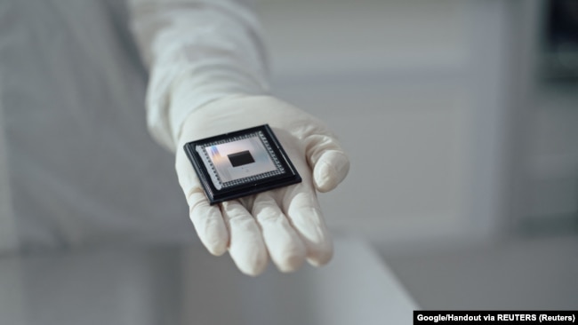 A person shows Google Quantum AI's "Willow" chip, in this undated handout photo obtained by Reuters on December 6, 2024. (Handout via REUTERS)