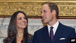 In this Nov. 16, 2010 file photo, Britain's Prince William and his fiancee Kate Middleton are seen at St. James's Palace in London, after they announced their engagement