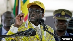 Zimbabwe's President Robert Mugabe addresses supporters at the elective congress in Harare, Zimbabwe, Dec. 4, 2014.