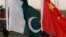 FILE - Flags of Pakistan and China fly during a joint anti-terrorism military exercises in Abbottabad, Pakistan, Dec. 11, 2006.
