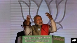 FILE - Indian Prime Minister Narendra Modi addresses a rally in New Delhi, India, Jan. 31, 2015.