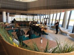 Virgin Galactic employees gather in the ground floor lounge at Spaceport America near Upham, New Mexico, Aug. 15, 2019.