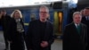 Britain's Prime Minister Keir Starmer, center, is greeted by Ukrainian officials and British ambassador to Ukraine Martin Harris, right, upon arrival at the train station in Kyiv on Jan. 16, 2025.