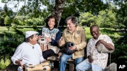 This undated image shows members of Planet Drum, from left, Giovanni Hidalgo, Zakir Hussain, Mickey Hart and Sikiru Adepoju.