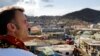 France's President Emmanuel Macron visits the Kavani district in Mamoudzou, on the French Indian Ocean territory of Mayotte on Dec. 19, 2024, following Cyclone Chido's passage over the archipelago.