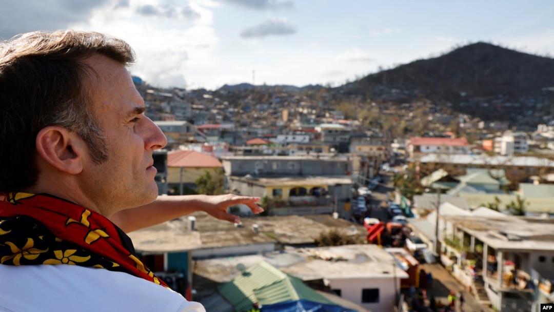 FILE - French President Emmanuel Macron visits the Kavani district in Mamoudzou on the French Indian Ocean territory of Mayotte on Dec. 19, 2024, following Cyclone Chido's passage over the archipelago.