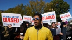 The National Center for Transgender Equality, NCTE, and the Human Rights Campaign gather on Pennsylvania Avenue in front of the White House in Washington, Oct. 22, 2018, for a #WontBeErased rally.