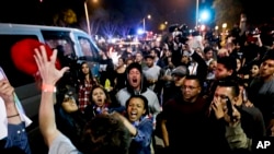 A Trump supporter clashes with protesters outside a rally for Republican presidential candidate Donald Trump in Costa Mesa, California, April 28, 2016. 