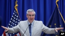 Gov. Eric Holcomb speaks during a news conference at the Statehouse, March 20, 2020, in Indianapolis. Holcomb said the Indiana presidential primary will be held on June 2 because of concern about the coronavirus pandemic. 