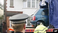 A car belonging to Taimour Abdulwahab, the suspected Stockholm suicide bomber, being removed by police in Luton, England, 13 Dec 2010