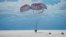 In this image provided by SpaceX, a capsule carrying four people parachutes into the Atlantic Ocean off the Florida coast, Sept. 18, 2021.