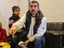 Omar left Syria years ago, after narrowly escaping a beheading by Islamic State militants. Now, he and his family are staying in a bus station after they were arrested and deported after crossing into Greece, March 19, 2020. (Heather Murdock/VOA)
